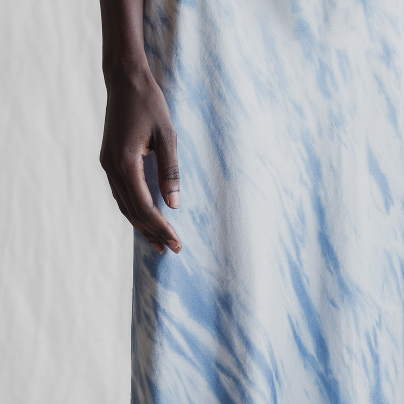 Close up of the 'Making Waves' overdyed silk slip dress with shibori technique